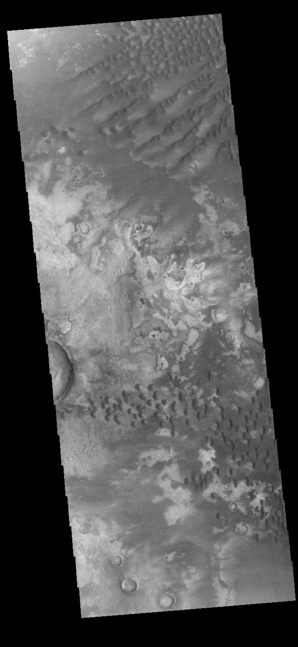 This VIS image shows part of the floor of Kaiser Crater. Kaiser Crater is 207 km (129 miles) in diameter and is located in Noachis Terra west of Hellas Planitia. This sand dune field is one of several regions of sand dunes located in the southern part of the crater floor. The small individual dunes at the bottom of the image indicate that in this region there is only limited amounts of sand available to form dunes. The image also shows the complex crater floor around the dunes.  Orbit Number: 90294 Latitude: -46.9286 Longitude: 18.9726 Instrument: VIS Captured: 2022-04-23 02:29  https://photojournal.jpl.nasa.gov/catalog/PIA25471