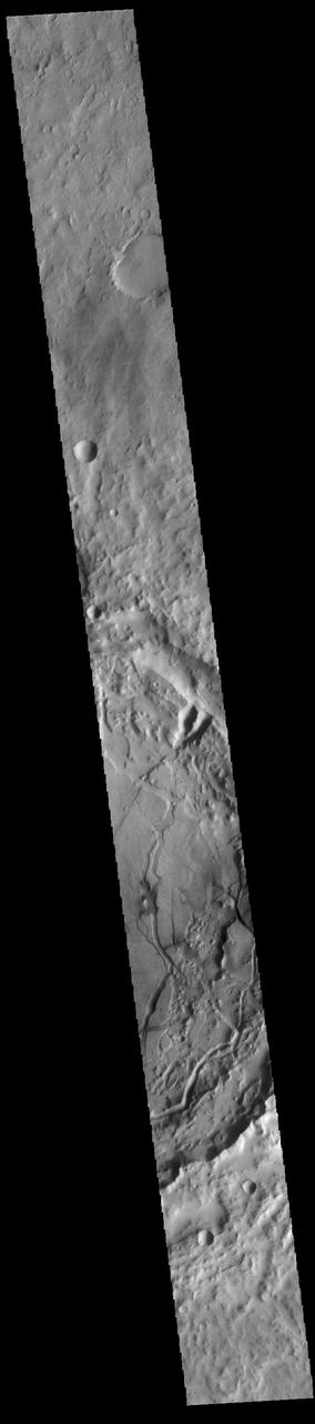 Today's VIS image shows a complex crater located in Terra Cimmeria, just north of Hesperia Planum. The floor of this unnamed crater has features indicating a substantial amount of crater fill material was deposited at some point after the formation of the crater. These materials have since been eroded into multiple different forms. There are valley and mesa forms in the bottom part of the crater in this image, with the valleys becoming more shallow and channel-like toward the northern part of the crater floor. It is thought that the formation of the valley and mesa formation (called chaos terrain) arises from the release of subsurface fluids. Orbit Number: 90328 Latitude: -8.81454 Longitude: 112.309 Instrument: VIS Captured: 2022-04-25 21:52 https://photojournal.jpl.nasa.gov/catalog/PIA25474