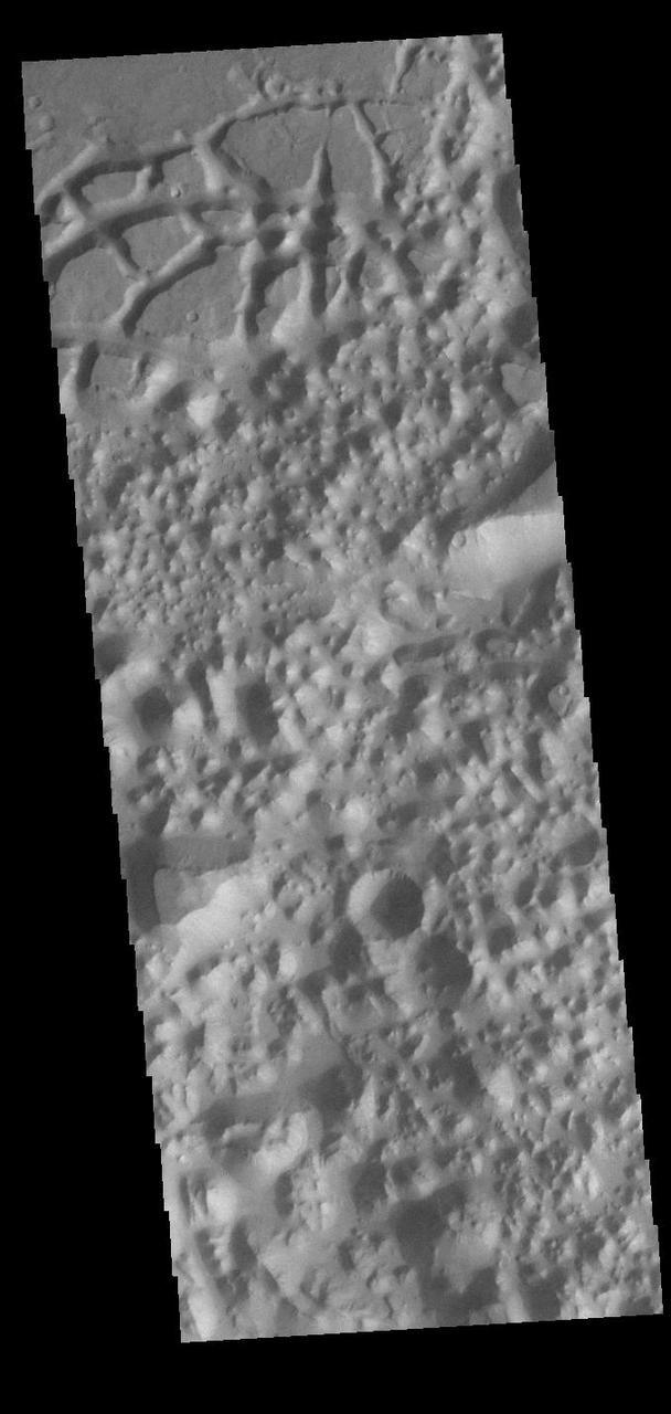Today's VIS image shows a region of chaos terrain south of Eos Chasma. Chaos terrain is typified by regions of blocky, often steep sided, mesas interspersed with deep valleys. With time and erosion the valleys widen and the mesas become smaller. It has been proposed that a catastrophic outflow of subsurface water creates the chaos. Orbit Number: 90820 Latitude: -16.5354 Longitude: 319.24 Instrument: VIS Captured: 2022-06-05 10:07 https://photojournal.jpl.nasa.gov/catalog/PIA25513