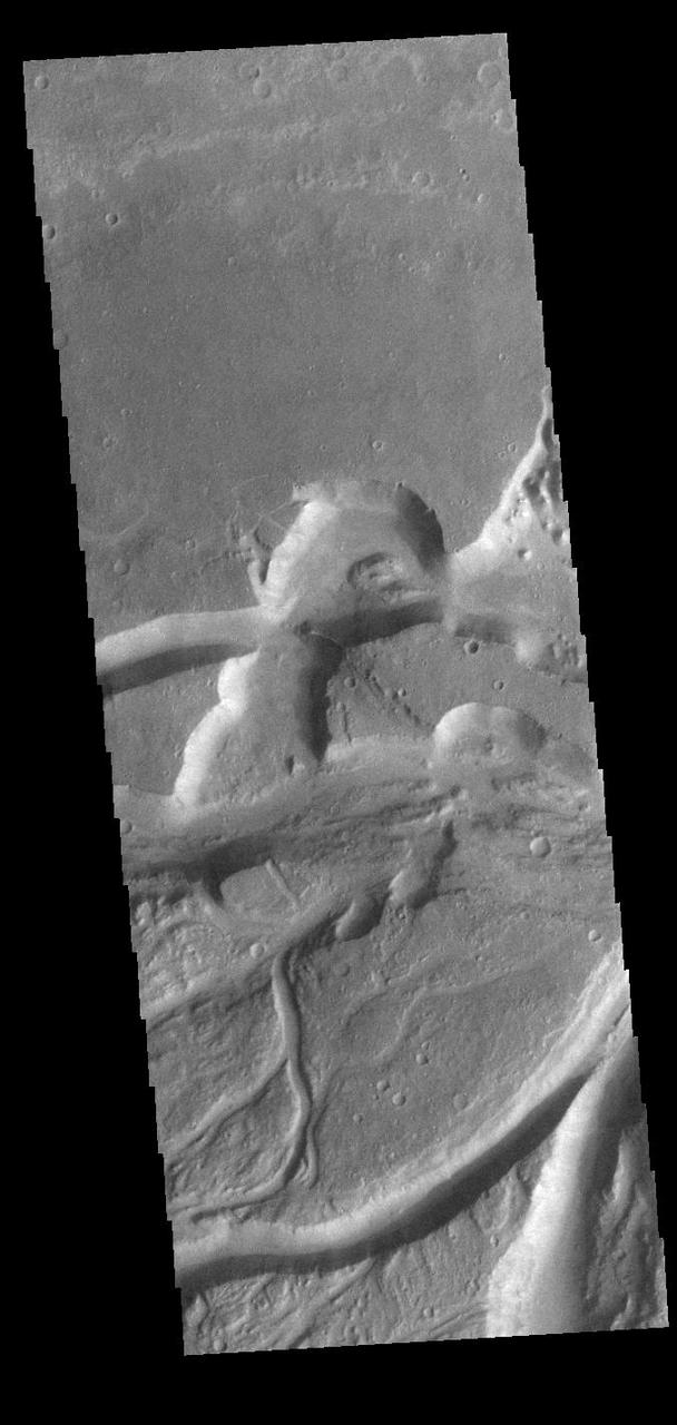Today's VIS image shows a small section of Osuga Valles. Osuga Valles is a complex set of channels located near Eos Chasma. The channels were likely cut by multiple episodes of flowing water. Osuga Valles is 164km (101 miles) long. Orbit Number: 91057 Latitude: -14.717 Longitude: 321.586 Instrument: VIS Captured: 2022-06-24 22:29 https://photojournal.jpl.nasa.gov/catalog/PIA25532