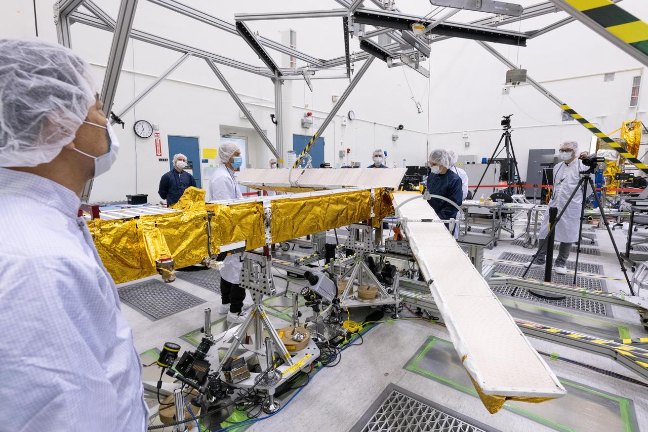 Members of the international Surface Water and Ocean Topography (SWOT) mission test one of the antennas for the Ka-band Radar Interferometer (KaRIn) instrument in a clean room at NASA's Jet Propulsion Laboratory in Southern California. The mission is a collaborative effort between NASA and the French space agency Centre National d'Études Spatiales (CNES) – with contributions from the Canadian Space Agency (CSA) and the UK Space Agency.      KaRIn is the scientific heart of the SWOT satellite, which will survey the water on more than 90% of Earth's surface, measuring the height of water in lakes, rivers, reservoirs, and the ocean. To do that, KaRIn will transmit radar pulses to Earth's surface and use its two antennas to triangulate the return signals that bounce back. Mounted at the ends of a boom 33 feet (10 meters) long, the antennas will collect data along a swath 30 miles (50 kilometers) wide on either side of the satellite.      KaRIn will operate in two modes: A lower-resolution mode over the ocean will involve significant onboard processing of the data to reduce the volume of information sent during downlinks to Earth; a higher-resolution mode will be used mainly over land.      Scheduled to launch from Vandenberg Space Force Base in Central California on Dec. 15, 2022, SWOT is being jointly developed by NASA and CNES, with contributions from the CSA and the UK Space Agency. NASA's Jet Propulsion Laboratory, which is managed for the agency by Caltech in Pasadena, California, leads the U.S. component of the project. For the flight system payload, NASA is providing the Ka-band Radar Interferometer (KaRIn) instrument, a GPS science receiver, a laser retroreflector, a two-beam microwave radiometer, and NASA instrument operations. CNES is providing the Doppler Orbitography and Radioposition Integrated by Satellite (DORIS) system, the dual frequency Poseidon altimeter (developed by Thales Alenia Space), the KaRIn radio-frequency subsystem (together with Thales Alenia Space and with support from the UK Space Agency), the satellite platform, and ground control segment. CSA is providing the KaRIn high-power transmitter assembly. NASA is providing the launch vehicle and associated launch services.  https://photojournal.jpl.nasa.gov/catalog/PIA25594
