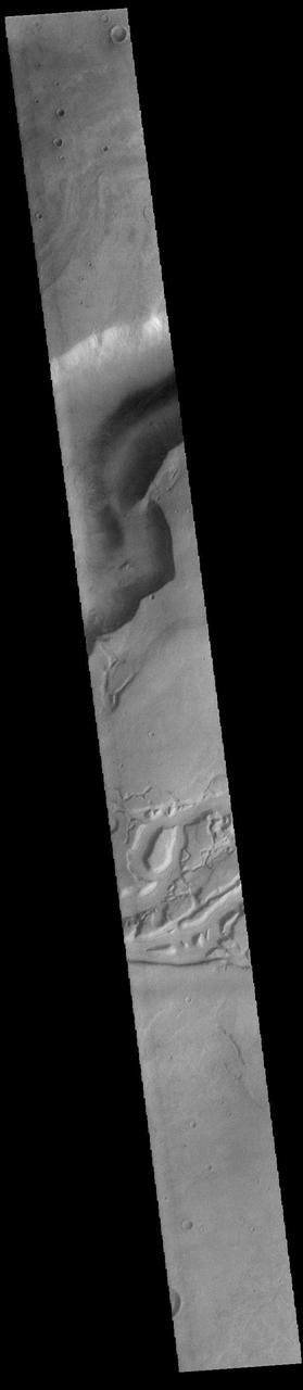 Today's VIS image shows a small portion of both Dao Vallis (top of image) and Niger Vallis (middle of image). Arising from the volcano Hadriacus Mons, Dao Vallis is approximately 1200km (750 miles) long. Niger Vallis is 333 km (207 miles) long. It has been proposed that heating of the region due to volcanic activity melted subsurface ice which was released to the surface to carve the two channels. Niger Vallis merges with Dao Vallis just off the image and then flow southwestward into the Hellas Planitia basin.  Orbit Number: 91427 Latitude: -36.3071 Longitude: 90.4526 Instrument: VIS Captured: 2022-07-25 09:32  https://photojournal.jpl.nasa.gov/catalog/PIA25601