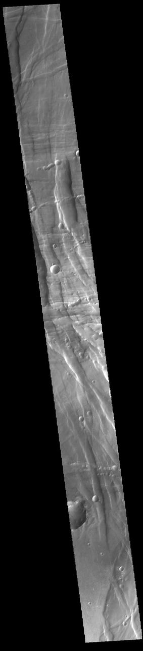 Located between the lava plains of Daedalia Planum and Solis Planum, Claritas Fossae is a graben filled highland. Graben are formed by tectonic activity, where extensional forces stretch the surface allowing blocks of material to slide down between paired faults. These linear grabens are termed fossae. This region of Mars had very active tectonism and volcanism, resulting in the huge volcanos like Arsia Mons and deep chasmata of Valles Marineris. Claritas Fossae was formed prior to the large lava flows of the Tharsis region. Orbit Number: 91646 Latitude: -14.0577 Longitude: 249.123 Instrument: VIS Captured: 2022-08-12 10:26 https://photojournal.jpl.nasa.gov/catalog/PIA25612