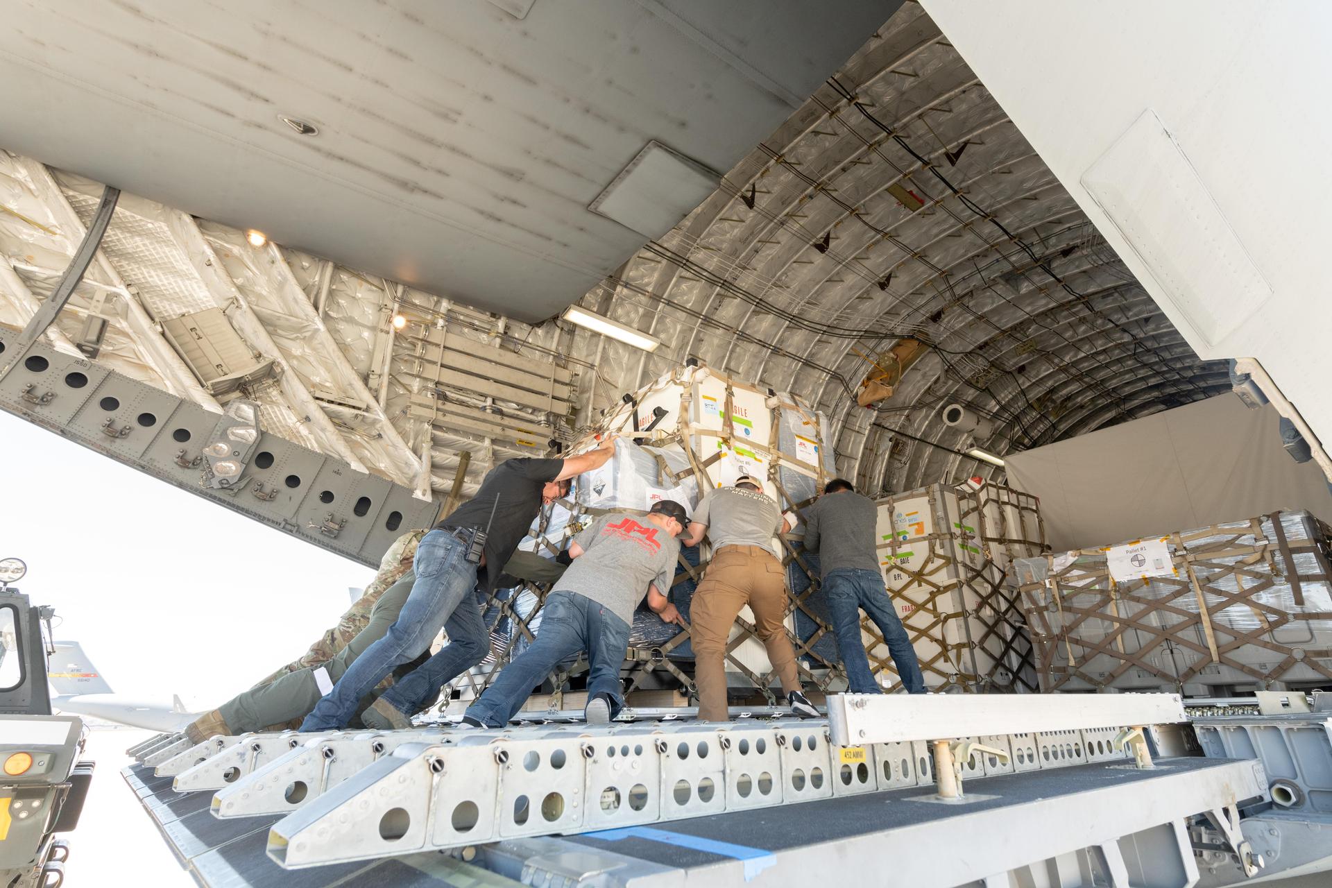 On June 27, 2021, teams from NASA's Jet Propulsion Laboratory and the March Air Reserve Base, loaded the scientific heart of the Surface Water and Ocean Topography (SWOT) mission into a C-17 airplane.