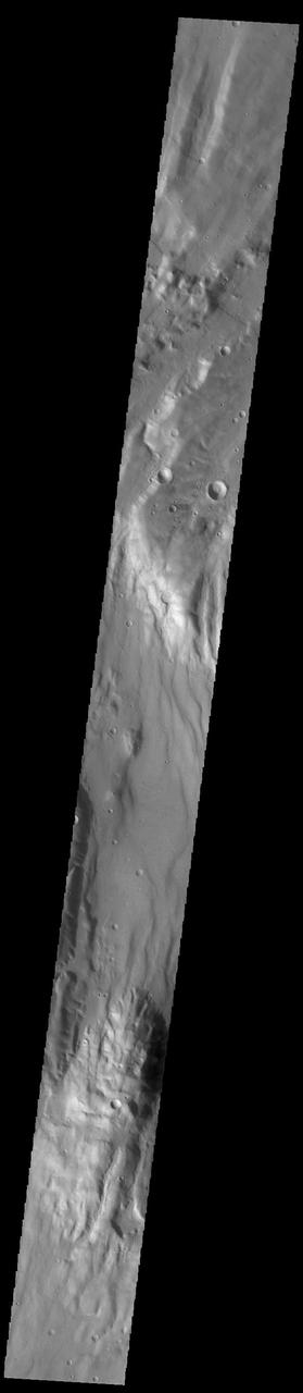 Today's VIS image shows an unnamed region of fractures and graben. Located south of Solis Planum, between Claitas Fossae and Coracis Fossae, this region of fossae has the same appearance and graben orientation of the bordering named Fossae. Fossae are long linear depressions called graben and are formed by extension of the crust and faulting. When large amounts of pressure or tension are applied to rocks on timescales that are fast enough that the rock cannot respond by deforming, the rock breaks along faults. In the case of a graben, two parallel faults are formed by extension of the crust and the rock in between the faults drops downward into the space created by the extension. Orbit Number: 91764 Latitude: -36.7342 Longitude: 272.1 Instrument: VIS Captured: 2022-08-22 02:55 https://photojournal.jpl.nasa.gov/catalog/PIA25635