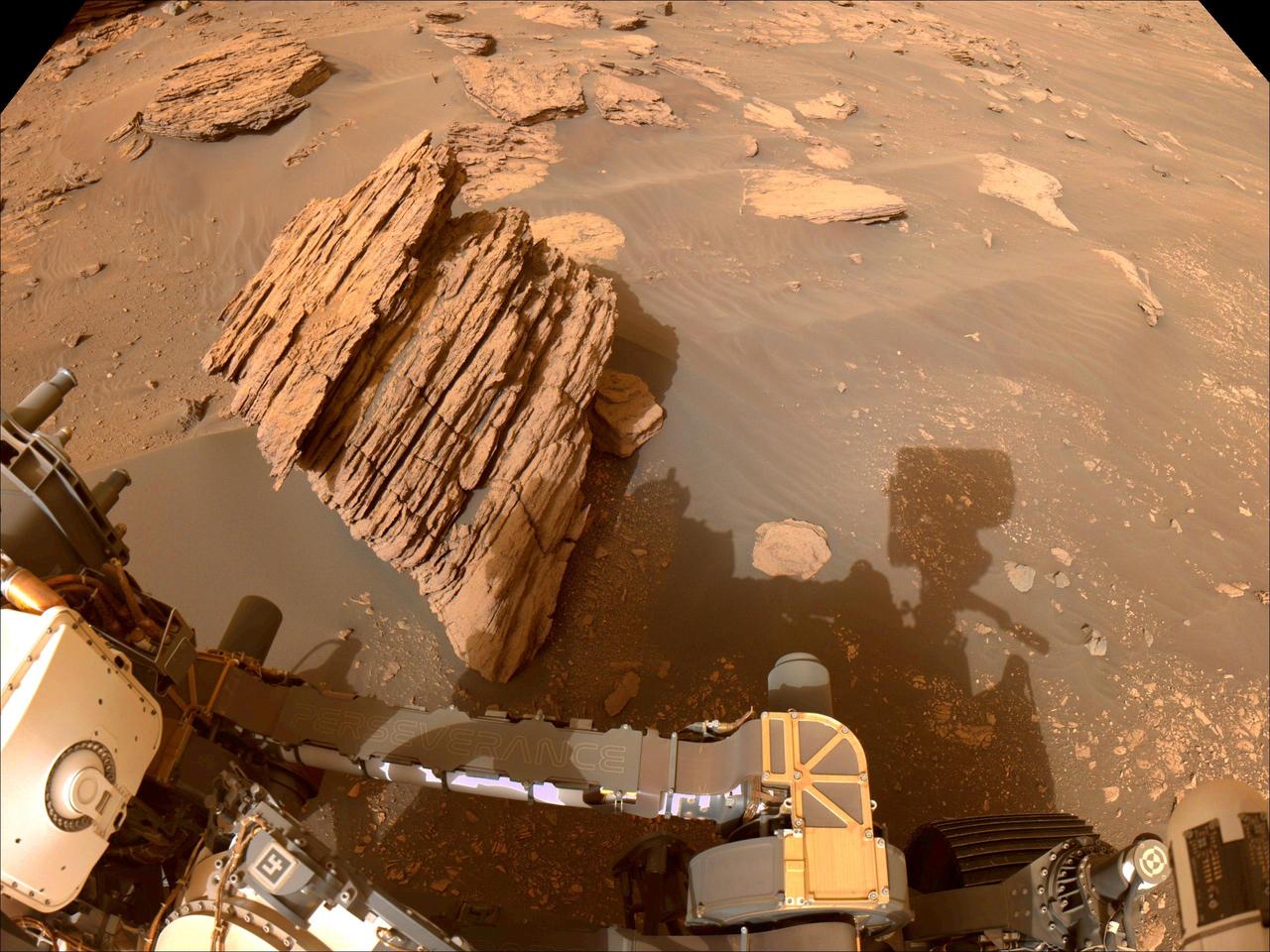 NASA's Perseverance Mars rover captured this image of "Bettys Rock" using one of the rover navigation cameras on June 20, 2022, the 474th Martian day, or sol, of the mission.  The rock is named after Bettys Rock in Shenandoah National Park.  A key objective for Perseverance's mission on Mars is astrobiology, including the search for signs of ancient microbial life. The rover will characterize the planet's geology and past climate, pave the way for human exploration of the Red Planet, and be the first mission to collect and cache Martian rock and regolith (broken rock and dust).  Subsequent NASA missions, in cooperation with ESA (European Space Agency), would send spacecraft to Mars to collect these sealed samples from the surface and return them to Earth for in-depth analysis.  The Mars 2020 Perseverance mission is part of NASA's Moon to Mars exploration approach, which includes Artemis missions to the Moon that will help prepare for human exploration of the Red Planet.  https://photojournal.jpl.nasa.gov/catalog/PIA25658