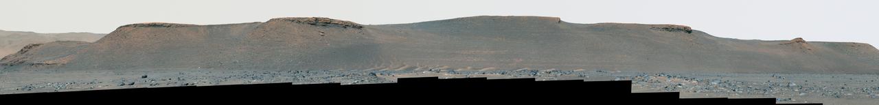 NASA's Perseverance rover used its Mastcam-Z camera to capture this enhanced color view of the eroded eastern edge of the delta within Mars' Jezero Crater on April 7, 2022, the 402nd Martian day, or sol, of the mission.  A deposit of boulders, at the edge of the delta, may have been moved there by high-energy floods in the ancient past. Perseverance will be exploring and sampling boulder deposits like this one in 2023 after dropping off its first cache of samples at a site called Three Forks as part of the Mars Sample Return campaign.  A key objective for Perseverance's mission on Mars is astrobiology, including the search for signs of ancient microbial life. The rover will characterize the planet's geology and past climate, pave the way for human exploration of the Red Planet, and be the first mission to collect and cache Martian rock and regolith (broken rock and dust).  Subsequent NASA missions, in cooperation with ESA (European Space Agency), would send spacecraft to Mars to collect these sealed samples from the surface and return them to Earth for in-depth analysis.  The Mars 2020 Perseverance mission is part of NASA's Moon to Mars exploration approach, which includes Artemis missions to the Moon that will help prepare for human exploration of the Red Planet.  Movie available at https://photojournal.jpl.nasa.gov/catalog/PIA25671