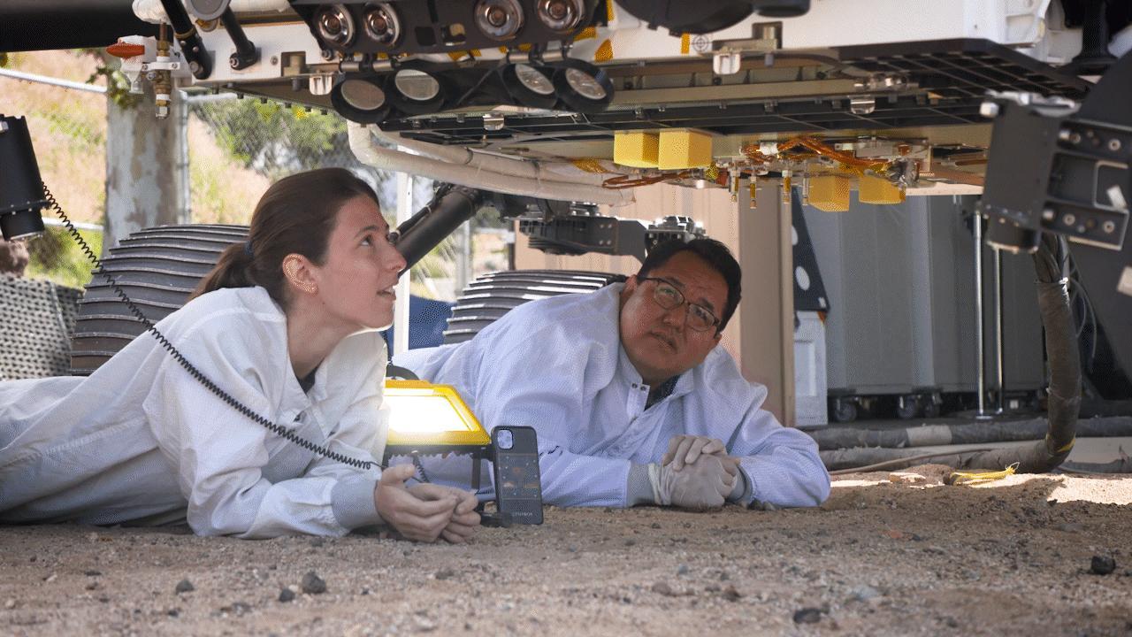 Engineers use OPTIMISM, a full-size replica of NASA's Perseverance rover, to test how it will deposit its first sample tube on the Martian surface. The test was conducted in the Mars Yard at NASA's Jet Propulsion Laboratory in Southern California.  A key objective for Perseverance's mission on Mars is astrobiology, including the search for signs of ancient microbial life. The rover will characterize the planet's geology and past climate, pave the way for human exploration of the Red Planet, and be the first mission to collect and cache Martian rock and regolith (broken rock and dust).  Subsequent NASA missions, in cooperation with ESA (European Space Agency), would send spacecraft to Mars to collect these sealed samples from the surface and return them to Earth for in-depth analysis.  The Mars 2020 Perseverance mission is part of NASA's Moon to Mars exploration approach, which includes Artemis missions to the Moon that will help prepare for human exploration of the Red Planet.  Movie available at https://photojournal.jpl.nasa.gov/catalog/PIA25676