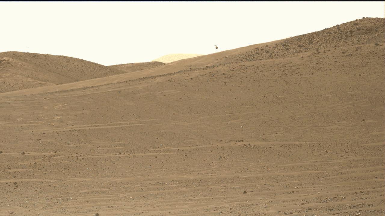 NASA's Ingenuity Mars Helicopter is seen here at the starting point of its 47th flight on Mars. This video shows the dust initially kicked up by the helicopter's spinning rotors, as well as Ingenuity taking off, hovering, and beginning its 1,444-foot (440-meter) journey to the southwest. The rotorcraft landed – off camera – at Airfield "Iota."  The video was captured by the Mastcam-Z imager aboard NASA's Perseverance rover on March 9, 2023. At the time the video was taken, the rover was about 394 feet (120 meters) from the helicopter.  Animation available at https://photojournal.jpl.nasa.gov/catalog/PIA25686 