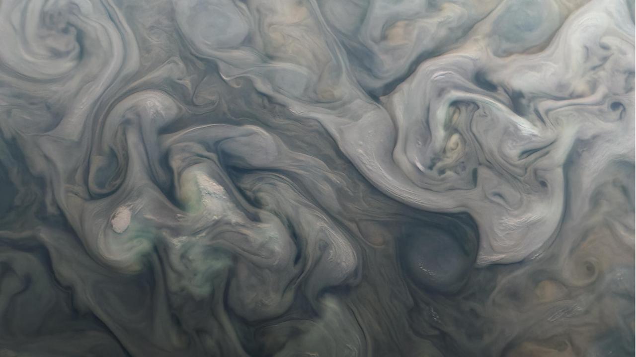 Swirling clouds on Jupiter are shown in an image taken by the JunoCam public engagement camera aboard NASA's Juno spacecraft on Feb. 25, 2022.  Juno's orbit around Jupiter changes every time the spacecraft passes the giant planet, with the point of closest approach – perijove, or "PJ" – moving steadily northward. As the perijove changes, the resolution of images taken in the northern hemisphere steadily increases. This zoomed-in cutout of a JunoCam image, acquired on PJ40 at 54 degrees north, shows new detail in the clouds and storms. Taken at an altitude of 4,133 miles (6,652 kilometers), the image reveals features as small as 2.8 miles (4.5 kilometers) across.  Citizen scientist Kevin M. Gill processed the images to enhance color and contrast.  https://photojournal.jpl.nasa.gov/catalog/PIA25691