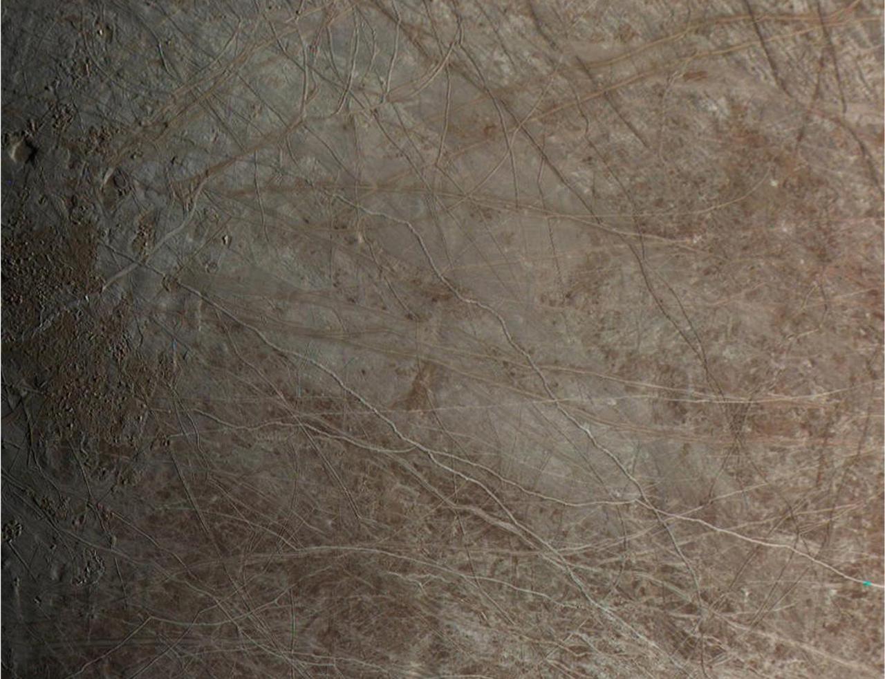 The surface of Jupiter's moon Europa is shown in an image from the JunoCam color public engagement camera aboard NASA's Juno spacecraft. The data for this image was taken Sept. 29, 2022.  During its flybys in the late 1990s and 2000, NASA's Galileo mission mapped much of Jupiter's moon Europa at a resolution of 0.6 miles per pixel (1 kilometer per pixel) or better, but there are some patches that were imaged only at low resolution. Images from JunoCam have now filled in one of those regions, shown here. Cracks, ridges, and bands show up clearly, and can be visually traced across images to match up to the cracks and ridges that appear in the earlier Galileo images. The way these features crosscut the surface can reveal which sections of the terrain are younger and which are older, helping scientists to fill in Europa's tectonic history.  Paul Schenk processed the images.  https://photojournal.jpl.nasa.gov/catalog/PIA25696