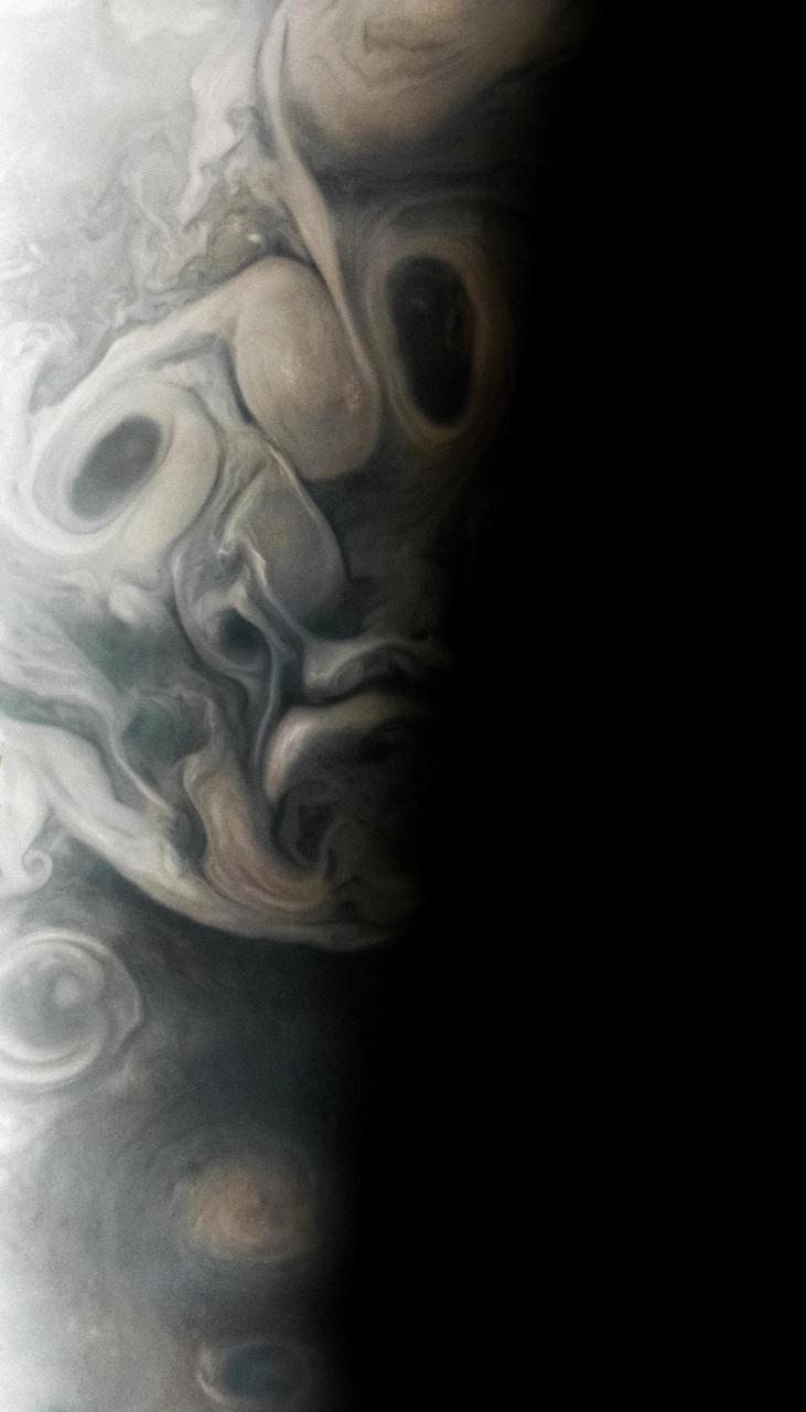 On Sept. 7, 2023, during its 54th close flyby of Jupiter, NASA's Juno mission captured this view of an area in the giant planet's far northern regions called Jet N7. The image shows turbulent clouds and storms along Jupiter's terminator, the dividing line between the day and night sides of the planet. The low angle of sunlight highlights the complex topography of features in this region, which scientists have studied to better understand the processes playing out in Jupiter's atmosphere.  As often occurs in views from Juno, Jupiter's clouds in this picture lend themselves to pareidolia, the effect that causes observers to perceive faces or other patterns in largely random patterns.  Citizen scientist Vladimir Tarasov made this image using raw data from the JunoCam instrument. At the time the raw image was taken, the Juno spacecraft was about 4,800 miles (about 7,700 kilometers) above Jupiter's cloud tops, at a latitude of about 69 degrees north.  https://photojournal.jpl.nasa.gov/catalog/PIA25727