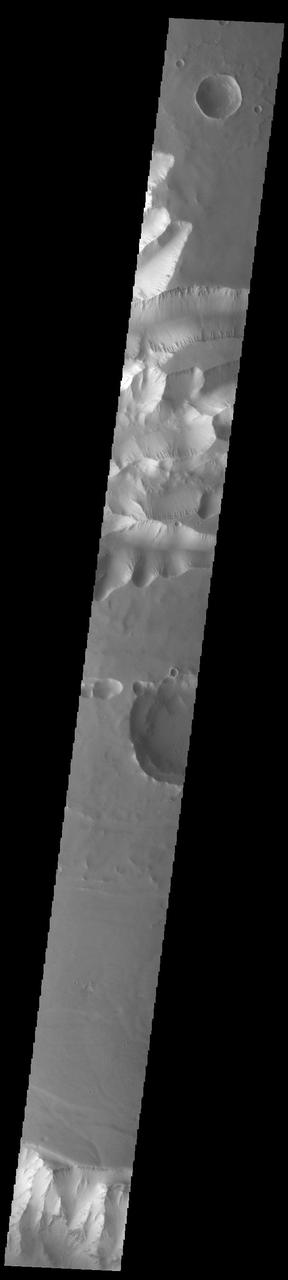 Today's VIS image shows the part of the eastern end of Tithonium Chasma. Tithonium Chasma is at the western end of Valles Marineris. Valles Marineris is over 4000 kilometers long, almost as wide as the United States. Tithonium Chasma is almost 810 kilometers long (499 miles), 50 kilometers wide and over 6 kilometers deep. In comparison, the Grand Canyon in Arizona is about 175 kilometers long, 30 kilometers wide, and only 2 kilometers deep. The canyons of Valles Marineris were formed by extensive fracturing and pulling apart of the crust during the uplift of the vast Tharsis plateau. In this image, the shallower regions of Tithonium are visible. The northern cliff of Ius Chasma is visible at the bottom of the image.  Orbit Number: 92650 Latitude: -5.20867 Longitude: 275.913 Instrument: VIS Captured: 2022-11-03 01:37  https://photojournal.jpl.nasa.gov/catalog/PIA25767