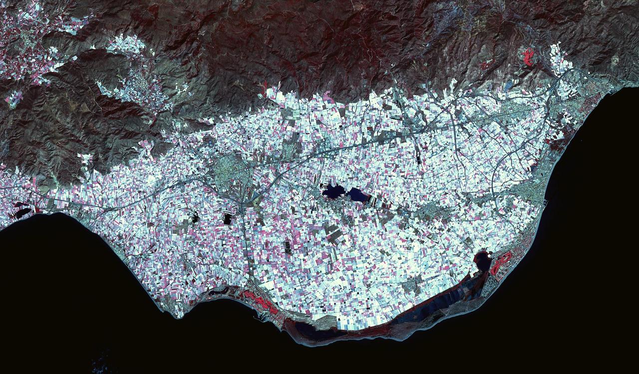 Poniente Almeriense in Almeria, Spain is also known as the Sea of Plastic due to the multitude of greenhouses that cover the area. Typical agricultural products grown under plastic are watermelons, eggplants, zucchinis, cucumbers, peppers and tomatoes. The image was acquired April 19, 2019, covers an area of 22 by 37.5 km, and is located at 36.8 degrees north, 2.7 degrees west. https://photojournal.jpl.nasa.gov/catalog/PIA25791