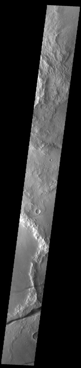Fossae are long linear depressions called graben and are formed by extension of the crust and faulting. When large amounts of pressure or tension are applied to rocks on timescales that are fast enough that the rock cannot respond by deforming, the rock breaks along faults. In the case of a graben, two parallel faults are formed by extension of the crust and the rock in between the faults drops downward into the space created by the extension. The graben in this VIS image are part of Memnonia Fossae. Memnonia Fossae, Mangala Fossae and Sirenum Fossae are all long graben systems that stretch from eastern Terra Sirenum into western Daedalia Planum. Orbit Number: 92952 Latitude: -20.9228 Longitude: 201.274 Instrument: VIS Captured: 2022-11-27 22:30 https://photojournal.jpl.nasa.gov/catalog/PIA25807