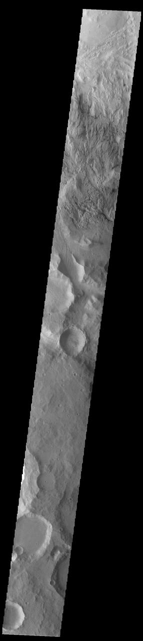 At the top of this VIS image is an area eroded by the wind. This region of the Martian surface is highly dissected by wind action. The surface materials are poorly cemented and easily eroded. It has been suggested that the surface is comprised of volcanic ash deposits, sourced from the Tharsis and Apollinaris volcanoes.  Orbit Number: 93116 Latitude: -8.25265 Longitude: 151.629 Instrument: VIS Captured: 2022-12-11 10:31  https://photojournal.jpl.nasa.gov/catalog/PIA25818