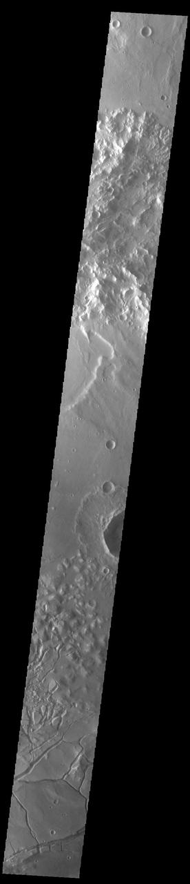The bottom portion of this VIS image shows part of Gorgonum Chaos. Chaos terrain is typified by regions of blocky, often steep sided, mesas interspersed with deep valleys. With time and erosion the valleys widen and the mesas become smaller. Chaotic regions form when groundwater escapes to the surface, undermining it and causing the ground to collapse. Gorgonum Chaos is located in Terra Sirenum. Orbit Number: 93127 Latitude: -36.2057 Longitude: 190.355 Instrument: VIS Captured: 2022-12-12 08:25 https://photojournal.jpl.nasa.gov/catalog/PIA25820