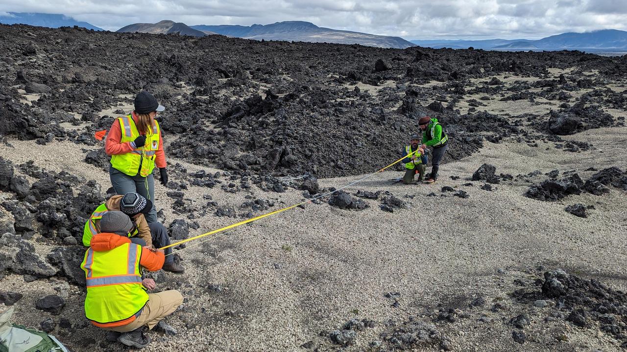During their August 2023 Iceland field campaign, international science team members of NASA's VERITAS (Venus Emissivity, Radio science, InSAR, Topography, And Spectroscopy) mission prepare for lidar (Light Detection and Ranging) imaging of rocks at a study area. Lidar measurements of rocky terrain can provide information about the material, such as surface roughness.  While the science team led by NASA's Jet Propulsion Laboratory gathered lidar data on the ground, their partners from the German Aerospace Center (Deutsches Zentrum für Luft- und Raumfahrt, or DLR) carried out overflights to gather radar observations of the same study areas. By doing this, the team was able to ground-truth the radar data that will be used to help inform the science that VERITAS will do at Venus.  VERITAS will peer through the planet's thick atmosphere with a suite of powerful science instruments to create global maps of Venus' surface – including topography, radar images, rock type, and gravity measurements – as well as detect surface changes. VERITAS is designed to understand what processes are currently active, search for evidence of past and current interior water, and understand the geologic evolution of the planet, illuminating how rocky planets throughout the galaxy evolve.  https://photojournal.jpl.nasa.gov/catalog/PIA25839