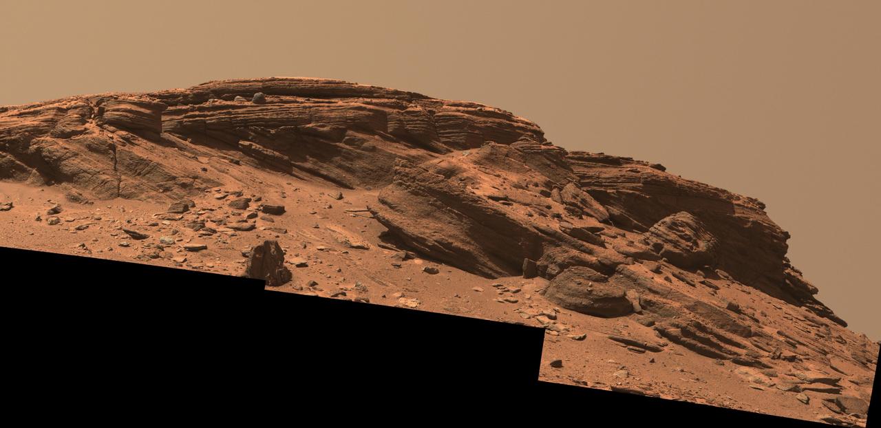 Sedimentary layers at "Franklin Cliffs" are displayed in a mosaic captured by NASA's Perseverance Mars rover using its Mastcam-Z camera on Feb. 12, 2023, the 704th Martian day, or sol, of the mission.  The mosaic is made up of three individual images that were stitched together after being sent back from Mars. This natural color view is approximately how the scene would appear to an average person if they were on Mars.  Franklin Cliffs, along with other locations like "Skrinkle Haven" and "Pinestand" may have been created as sediment built up here in an ancient river or delta.  Arizona State University leads the operations of the Mastcam-Z instrument, working in collaboration with Malin Space Science Systems in San Diego, on the design, fabrication, testing, and operation of the cameras, and in collaboration with the Niels Bohr Institute of the University of Copenhagen on the design, fabrication, and testing of the calibration targets.  A key objective for Perseverance's mission on Mars is astrobiology, including the search for signs of ancient microbial life. The rover will characterize the planet's geology and past climate, pave the way for human exploration of the Red Planet, and be the first mission to collect and cache Martian rock and regolith (broken rock and dust).  Subsequent NASA missions, in cooperation with ESA (European Space Agency), would send spacecraft to Mars to collect these sealed samples from the surface and return them to Earth for in-depth analysis.  The Mars 2020 Perseverance mission is part of NASA's Moon to Mars exploration approach, which includes Artemis missions to the Moon that will help prepare for human exploration of the Red Planet.  https://photojournal.jpl.nasa.gov/catalog/PIA25911