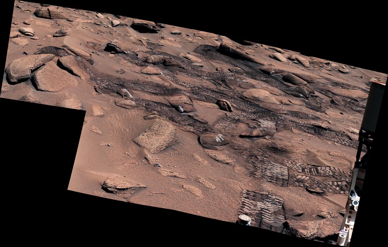 NASA's Curiosity Mars rover left these tracks after trying multiple times to crest a slippery slope. This mosaic, made up of seven images that were stitched together after being sent back to Earth, was captured by the rover's Mastcam on June 13, 2023, the 3,858th Martian day, or sol, of the mission. The color has been adjusted to match lighting conditions as the human eye would see them on Earth. Curiosity struggled to climb a 23-degree slope that had slippery sand and wheel-size boulders. These three factors – the incline, the sand, and the large boulders – combined to make this Curiosity's toughest climb yet. https://photojournal.jpl.nasa.gov/catalog/PIA25920
