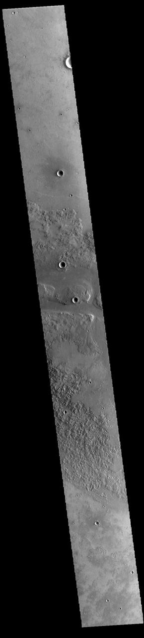 This VIS image shows one of the channels that comprise Granicus Valles. Granicus Valles is a complex channel system located west of Elysium Mons. The system is approximately 750km long (466 miles). It is likely that both water and lava played a part in creation of the feature. Orbit Number: 93946 Latitude: 28.3677 Longitude: 129.844 Instrument: VIS Captured: 2023-02-17 19:48 https://photojournal.jpl.nasa.gov/catalog/PIA25934