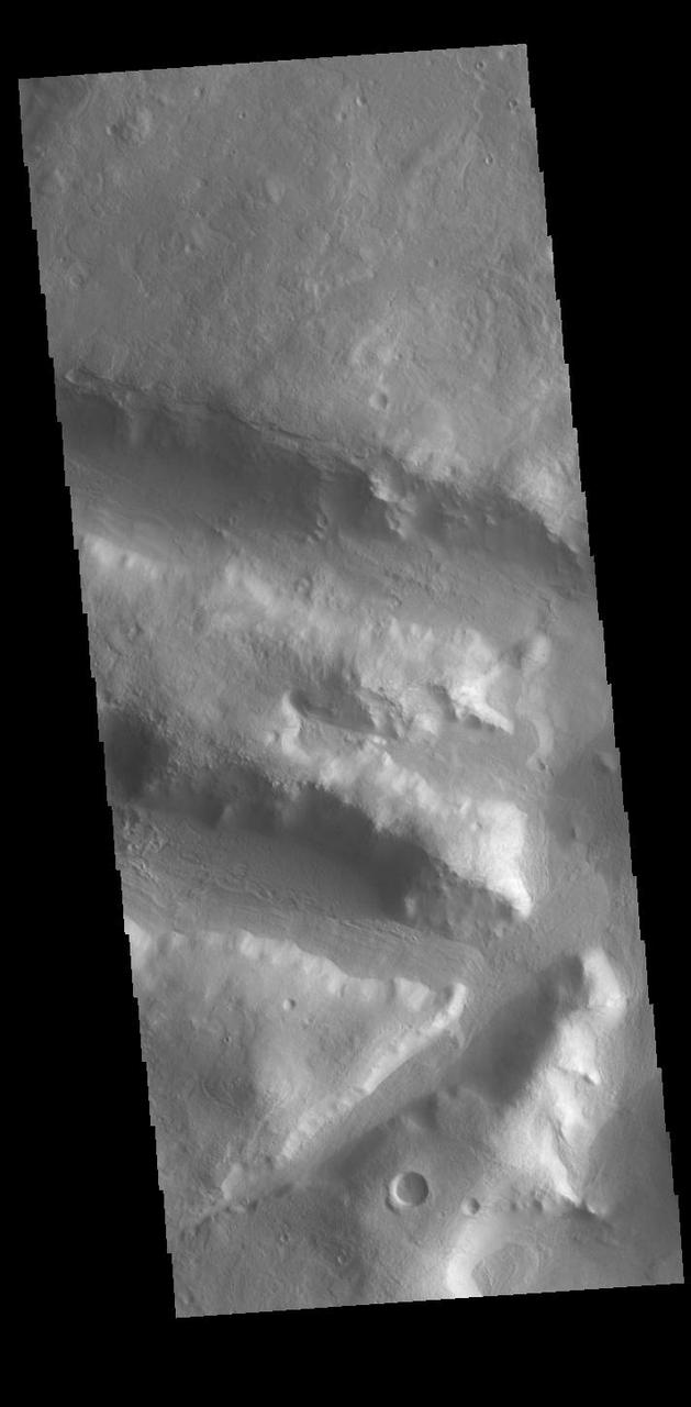Today's VIS image is located in northern Terra Sabaea, on the topographic boundary between the highlands of Terra Sabaea and the lower elevations of Utopia Planitia. Numerous channels and graben dissect this region. Orbit Number: 94023 Latitude: 33.809 Longitude: 67.6676 Instrument: VIS Captured: 2023-02-24 03:59 https://photojournal.jpl.nasa.gov/catalog/PIA25943