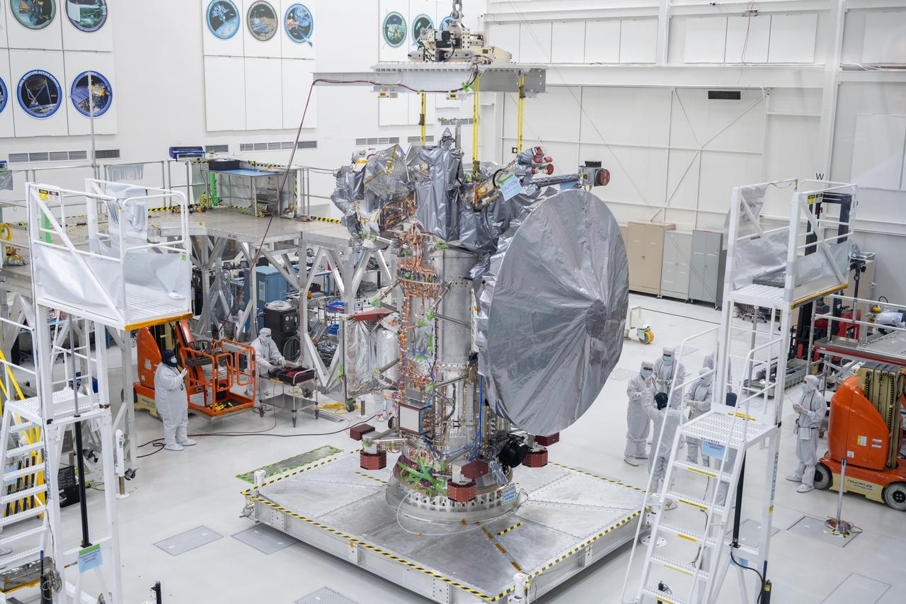 NASA's Europa Clipper spacecraft boasts its new 10-foot (3-meter) high-gain antenna, after its Aug. 14, 2023, installation in High Bay 1 of the Spacecraft Assembly Facility at the agency's Jet Propulsion Laboratory in Southern California. The orbiter is being assembled in preparation for launch to Jupiter's moon Europa in October 2024. The precision-engineered dish was attached to the spacecraft in carefully choreographed stages over the course of several hours.  Europa Clipper will need the huge antenna to transmit data hundreds of millions of miles back to Earth. Scientists believe the icy moon Europa harbors a vast internal ocean that may have conditions suitable for supporting life. The spacecraft will fly by the moon about 50 times while its science instruments gather data on the moon's atmosphere, surface, and interior – information that will help scientists learn more about the ocean, the ice crust, and potential plumes that may be venting subsurface water into space.   https://photojournal.jpl.nasa.gov/catalog/PIA25958