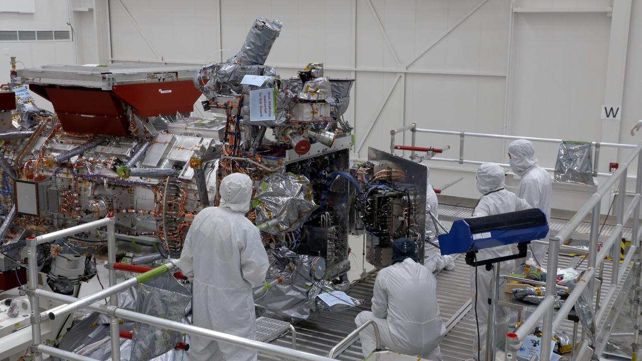 Engineers and technicians are seen closing the vault of NASA's Europa Clipper in the main clean room of the Spacecraft Assembly Facility at the agency's Jet Propulsion Laboratory in Southern California on Oct. 7, 2023. The vault will protect the sophisticated electronics of the spacecraft as it orbits Jupiter and endures one of the most punishing radiation environments in our solar system.  The mission is targeting October 2024 for the launch of its spacecraft, which will fly by Europa about 50 times.  Europa Clipper's main science goal is to determine whether there are places below Jupiter's icy moon, Europa, that could support life. The mission's three main science objectives are to determine the thickness of the moon's icy shell and its surface interactions with the ocean below, to investigate its composition, and to characterize its geology. The mission's detailed exploration of Europa will help scientists better understand the astrobiological potential for habitable worlds beyond our planet.  https://photojournal.jpl.nasa.gov/catalog/PIA25959