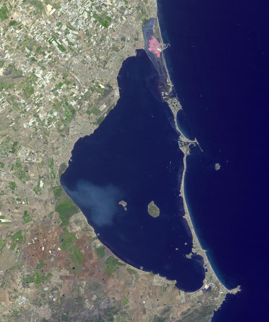 Mar Menor, in southeast Spain, is Europe's largest coastal saltwater lagoon. For the past 40 years, Mar Menor has faced severe contamination from agricultural runoff, leading to large algal blooms, and ecological degradation. Now, major restoration and prevention programs are in place to restore the lagoon, and try to reverse the damage. The image was acquired August 24, 2023, covers an area of 22.6 by 27.4 km, and is located at 37.7 degrees north, 0.8 degrees west. With its 14 spectral bands from the visible to the thermal infrared wavelength region and its high spatial resolution of about 50 to 300 feet (15 to 90 meters), ASTER images Earth to map and monitor the changing surface of our planet. ASTER is one of five Earth-observing instruments launched Dec. 18, 1999, on Terra. The instrument was built by Japan's Ministry of Economy, Trade and Industry. A joint U.S./Japan science team is responsible for validation and calibration of the instrument and data products. The broad spectral coverage and high spectral resolution of ASTER provides scientists in numerous disciplines with critical information for surface mapping and monitoring of dynamic conditions and temporal change. Example applications are monitoring glacial advances and retreats; monitoring potentially active volcanoes; identifying crop stress; determining cloud morphology and physical properties; wetlands evaluation; thermal pollution monitoring; coral reef degradation; surface temperature mapping of soils and geology; and measuring surface heat balance. https://photojournal.jpl.nasa.gov/catalog/PIA26009