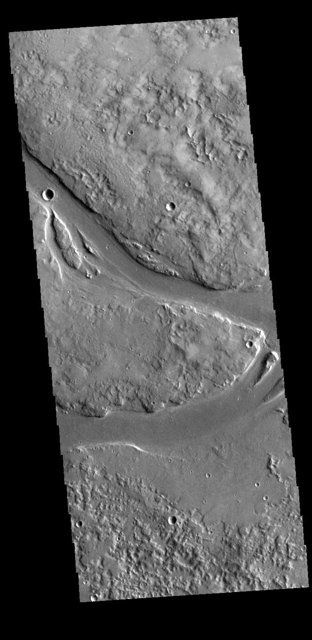 This VIS image shows part of Granicus Valles. Granicus Valles is a complex channel system located west of Elysium Mons. The system is approximately 750km (466 miles) long. It is likely that both water and lava played a part in creation of the feature. Orbit Number: 94545 Latitude: 28.4791 Longitude: 129.351 Instrument: VIS Captured: 2023-04-08 03:29 https://photojournal.jpl.nasa.gov/catalog/PIA26033