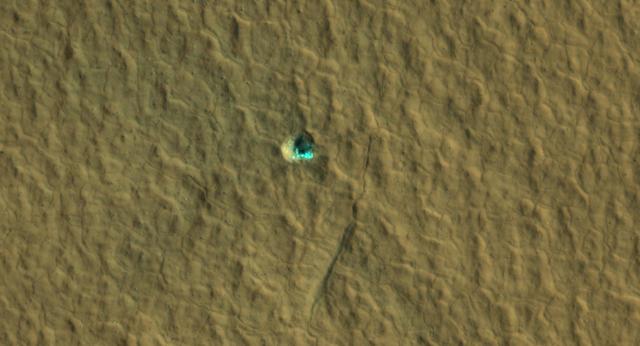  Ice-Exposing Impact Crater Surrounded by Polygon Terrain