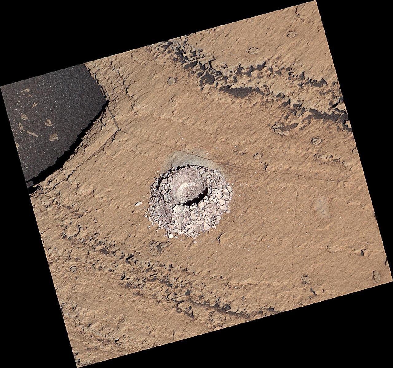 NASA's Curiosity Mars rover used the drill on the end of its robotic arm to collect a sample from a rock nicknamed "Sequoia" on Oct. 17, 2023, the 3,980th Martian day, or sol, of the mission. The mission was naming science targets after locations in California's Sierra Nevada mountain range at the time this sample was collected. This image was captured by the rover's Mast Camera, or Mastcam.  https://photojournal.jpl.nasa.gov/catalog/PIA26048