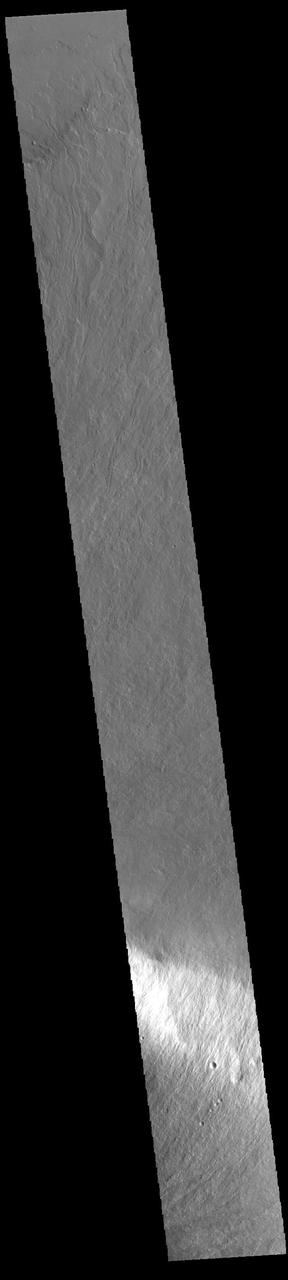 Today's VIS image shows part of the lower flank of Olympus Mons. The bright band in the image is an escarpment, where there is a large elevation change over a very short linear range – a cliff. This escarpment is called Olympus Rupes. In 2-D images it is very difficult to interpret the height component. In this case, the elevation change from the highest point (bottom of image) to the lowest point (top of image) is 7757m (25,449 feet). Olympus Mons is 21.9km (13.6 miles, 72,000 feet) tall. For comparison, Mt Everest is only 29,032 feet tall.  Orbit Number: 94579 Latitude: 22.7256 Longitude: 229.336 Instrument: VIS Captured: 2023-04-10 22:38  https://photojournal.jpl.nasa.gov/catalog/PIA26055