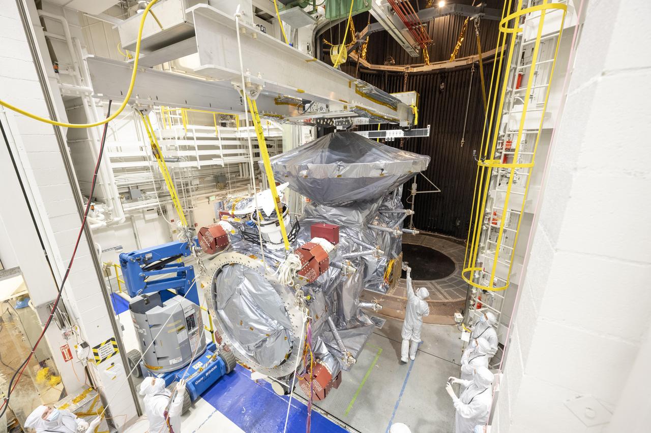 NASA's Europa Clipper spacecraft is seen in the 85-foot-tall, 25-foot-wide (26-meter-by-8-meter) vacuum chamber, known as the Space Simulator, at the agency's Jet Propulsion Laboratory in Southern California in February 2024. Shortly after this photo was taken, the spacecraft underwent 16 days of thermal vacuum chamber (TVAC) testing so that engineers can be sure the hardware will survive the extreme temperatures and airless environment of space. TVAC is part of a regimen called environmental testing that takes place before spacecraft are approved for flight.  Europa Clipper, set to launch in October 2024 from Kennedy Space Center in Florida, will arrive at the Jupiter system in 2030 and conduct about 50 flybys of the moon Europa. The mission's main science goal is to determine whether there are places below the surface of Europa that could support life. The mission's three main science objectives are to determine the thickness of the moon's icy shell and its surface interactions with the ocean below, to investigate its composition, and to characterize its geology. The mission's detailed exploration of Europa will help scientists better understand the astrobiological potential for habitable worlds beyond our planet.  https://photojournal.jpl.nasa.gov/catalog/PIA26065