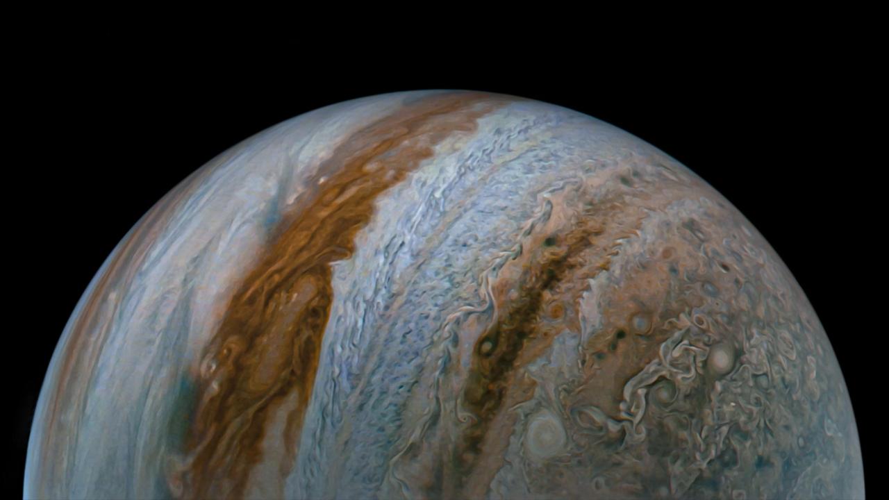 NASA's Juno spacecraft captured this view of Jupiter during the mission's 54th close flyby of the giant planet on Sept. 7, 2023. The colorful zones and belts in Jupiter's atmosphere run from the cloud tops down to approximately 1,860 miles (3,000 kilometers).  Citizen scientist Tanya Oleksuik made this image using raw data from the JunoCam instrument, processing the data to enhance details in cloud features and colors. At the time the raw image was taken, the Juno spacecraft was about 52,400 miles (about 84,400 kilometers) above Jupiter's cloud tops.  https://photojournal.jpl.nasa.gov/catalog/PIA26077