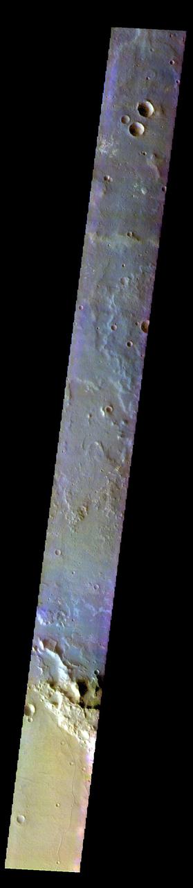 The THEMIS VIS camera contains 5 filters. The data from different filters can be combined in multiple ways to create a false color image. These false color images may reveal subtle variations of the surface not easily identified in a single band image. Today's false color image shows part of Terra Cimmeria. The THEMIS VIS camera is capable of capturing color images of the Martian surface using five different color filters. In this mode of operation, the spatial resolution and coverage of the image must be reduced to accommodate the additional data volume produced from using multiple filters. To make a color image, three of the five filter images (each in grayscale) are selected. Each is contrast enhanced and then converted to a red, green, or blue intensity image. These three images are then combined to produce a full color, single image. Because the THEMIS color filters don't span the full range of colors seen by the human eye, a color THEMIS image does not represent true color. Also, because each single-filter image is contrast enhanced before inclusion in the three-color image, the apparent color variation of the scene is exaggerated. Nevertheless, the color variation that does appear is representative of some change in color, however subtle, in the actual scene. Note that the long edges of THEMIS color images typically contain color artifacts that do not represent surface variation. Orbit Number: 91605 Latitude: -30.5661 Longitude: 180.166 Instrument: VIS Captured: 2022-08-09 00:41 https://photojournal.jpl.nasa.gov/catalog/PIA26082