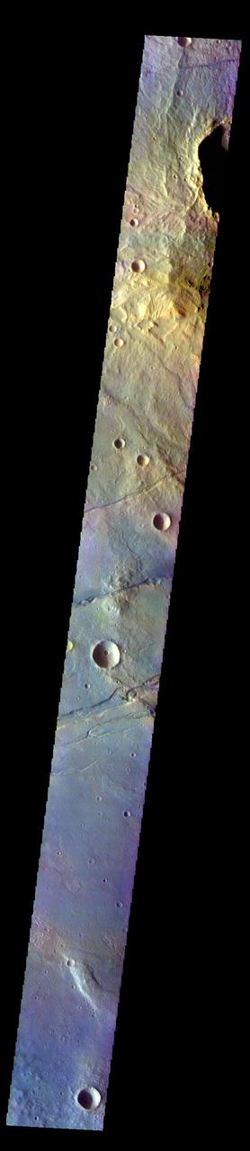 The THEMIS VIS camera contains 5 filters. The data from different filters can be combined in multiple ways to create a false color image. These false color images may reveal subtle variations of the surface not easily identified in a single band image. Today's false color image shows part of Sirenum Fossae. The linear depressions in this VIS image are tectonic graben. Graben are formed by extension of the crust and faulting. When large amounts of pressure or tension are applied to rocks on timescales that are fast enough that the rock cannot respond by deforming, the rock breaks along faults. In the case of a graben, two parallel faults are formed by extension of the crust and the rock in between the faults drops downward into the space created by the extension. Several graben are visible in this THEMIS VIS image, trending from north-northeast to south-southwest. Because the faults defining the graben are formed perpendicular to the direction of the applied stress, we know that extensional forces were pulling the crust apart in the west-northwest/east-southeast direction. The Sirenum Fossae graben are 2735km (1700 miles) long.  The THEMIS VIS camera is capable of capturing color images of the Martian surface using five different color filters. In this mode of operation, the spatial resolution and coverage of the image must be reduced to accommodate the additional data volume produced from using multiple filters. To make a color image, three of the five filter images (each in grayscale) are selected. Each is contrast enhanced and then converted to a red, green, or blue intensity image. These three images are then combined to produce a full color, single image. Because the THEMIS color filters don't span the full range of colors seen by the human eye, a color THEMIS image does not represent true color. Also, because each single-filter image is contrast enhanced before inclusion in the three-color image, the apparent color variation of the scene is exaggerated. Nevertheless, the color variation that does appear is representative of some change in color, however subtle, in the actual scene. Note that the long edges of THEMIS color images typically contain color artifacts that do not represent surface variation.  Orbit Number: 92203 Latitude: -31.0389 Longitude: 208.065 Instrument: VIS Captured: 2022-09-27 06:25  https://photojournal.jpl.nasa.gov/catalog/PIA26087