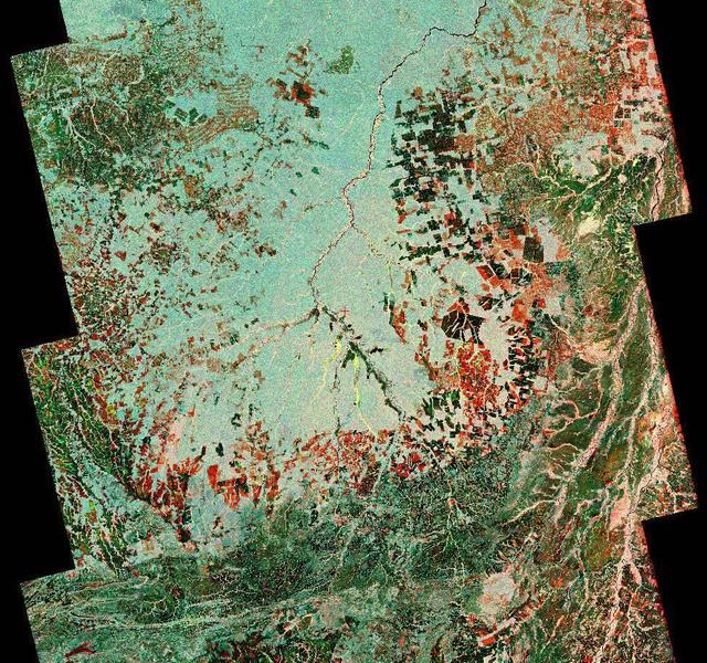 To show the kind of imagery that data from the NISAR (NASA-ISRO Synthetic Aperture Radar) satellite mission will produce, researchers pointed to this composite image of a portion of the so-called "arc of deforestation," a region on the southeast edge of the Amazonian jungle in Brazil where forests are being cleared at a fast pace through human activity. This three-color image shows change to the land cover in the Xingu River basin between 1996 (red) and 2007 (blue/green), using data from the Japanese L-band SAR satellites JERS-1 and ALOS-1, respectively. Black indicates areas converted from rainforest to agricultural land prior to 1996, and red shows the additional areas that had been cleared by 2007. NISAR will offer detailed insights into how the planet's forest ecosystems are changing over time, which will help researchers understand regional and global dynamics of deforestation and study the role of wooded areas in the global carbon cycle. NISAR could also help improve accounting of forest loss and growth, as countries that rely on logging try to shift toward more sustainable practices. NISAR is a joint mission of the U.S. and Indian space agencies. When in orbit, its sophisticated L- and S-band radar systems will scan nearly all of Earth's land and ice surfaces twice every 12 days with exquisite precision. Scheduled to launch in early 2024, NISAR is an equal collaboration between NASA and the Indian Space Research Organisation and marks the first time the two agencies have cooperated on hardware development for an Earth-observing mission. NASA's Jet Propulsion Laboratory, which is managed for the agency by Caltech in Pasadena, leads the U.S. component of the project and is providing the mission's L-band SAR. NASA is also providing the radar reflector antenna, the deployable boom, a high-rate communication subsystem for science data, GPS receivers, a solid-state recorder, and payload data subsystem. ISRO's U R Rao Satellite Centre in Bengaluru, which is leading the ISRO component of the mission, is providing the spacecraft bus, the S-band SAR electronics, the launch vehicle, and associated launch services and satellite mission operations. https://photojournal.jpl.nasa.gov/catalog/PIA26111
