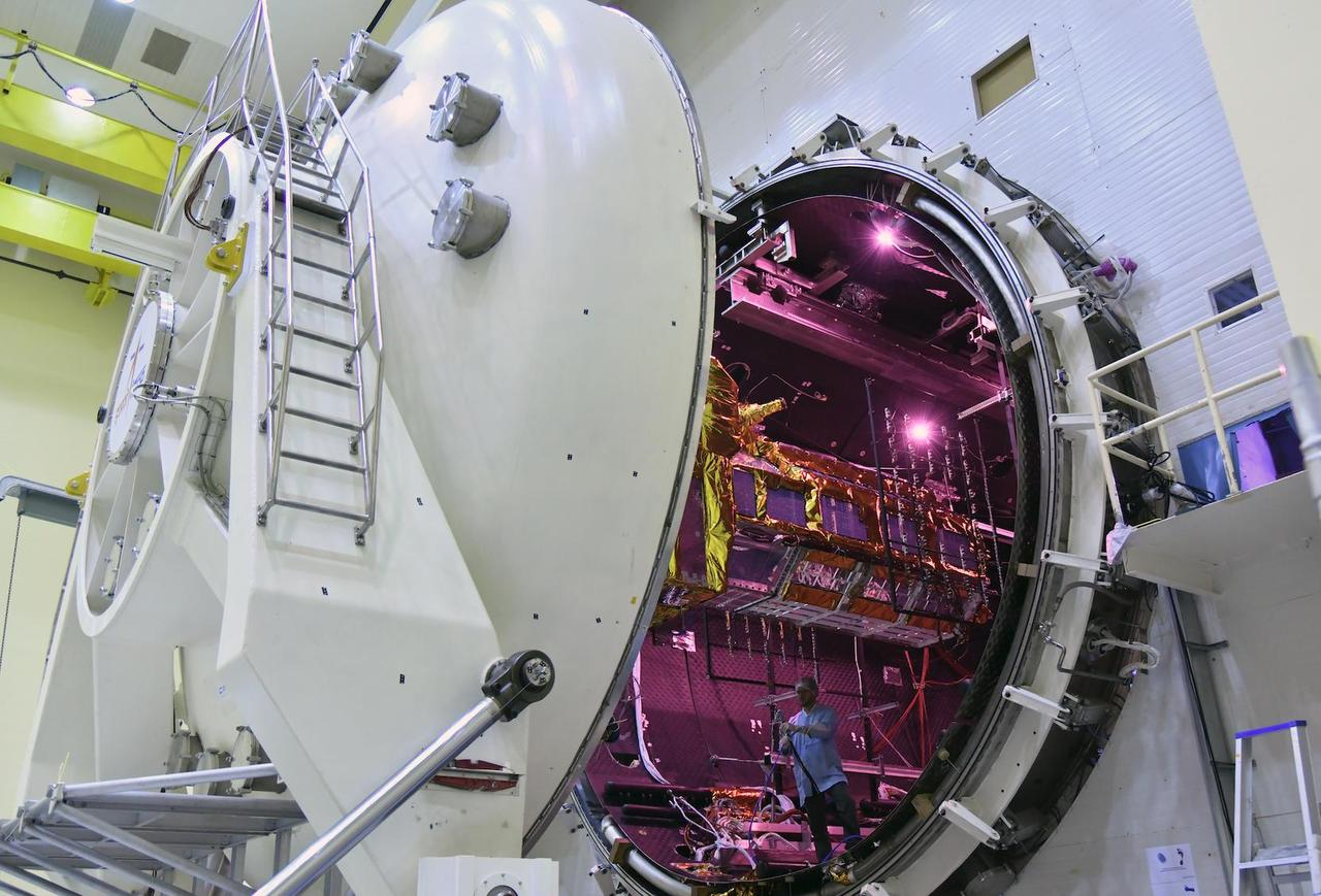 The NISAR satellite, partially covered in gold-hued thermal blanketing, enters the thermal vacuum chamber at the Indian Space Research Organisation's Satellite Integration and Test Establishment (ISITE) in Bengaluru, India, on Oct. 19, 2023. Short for NASA-ISRO Synthetic Aperture Radar, NISAR was bound for a 21-day trial aimed at evaluating its ability to function in the extreme temperatures and the vacuum of space. The satellite emerged from the chamber on Nov. 13, having met all requirements of the test.  Teams from ISRO and NASA's Jet Propulsion Laboratory worked around the clock, evaluating the performance of the satellite's thermal systems and its two primary science instrument systems – the L-band and S-band radars – under the most extreme temperature conditions they will experience in space.  During the three-week period, engineers and technicians lowered the pressure inside the chamber to an infinitesimal fraction of the normal pressure at sea level. They also subjected the satellite to an 80-hour "cold soak" at 14 degrees Fahrenheit (minus 10 degrees Celsius), followed by an equally lengthy "hot soak" at up to 122 F (50 C). This simulates the temperature swings the spacecraft will experience as it is exposed to sunlight and darkness in orbit.  After further tests, the satellite will be transported about 220 miles (350 kilometers) eastward to Satish Dhawan Space Centre, where it will be inserted into its launch faring, mounted atop ISRO's Geosynchronous Satellite Launch Vehicle Mark II rocket, and sent into low-Earth orbit.  NISAR is the first space-hardware collaboration between NASA and ISRO on an Earth-observing mission. Scheduled to launch in early 2024, the satellite will scan nearly all of the planet's land and ice twice every 12 days, monitoring the motion of those surfaces down to fractions of an inch. It will also track other processes, including the dynamics of forests, wetlands, and agricultural lands.  https://photojournal.jpl.nasa.gov/catalog/PIA26114