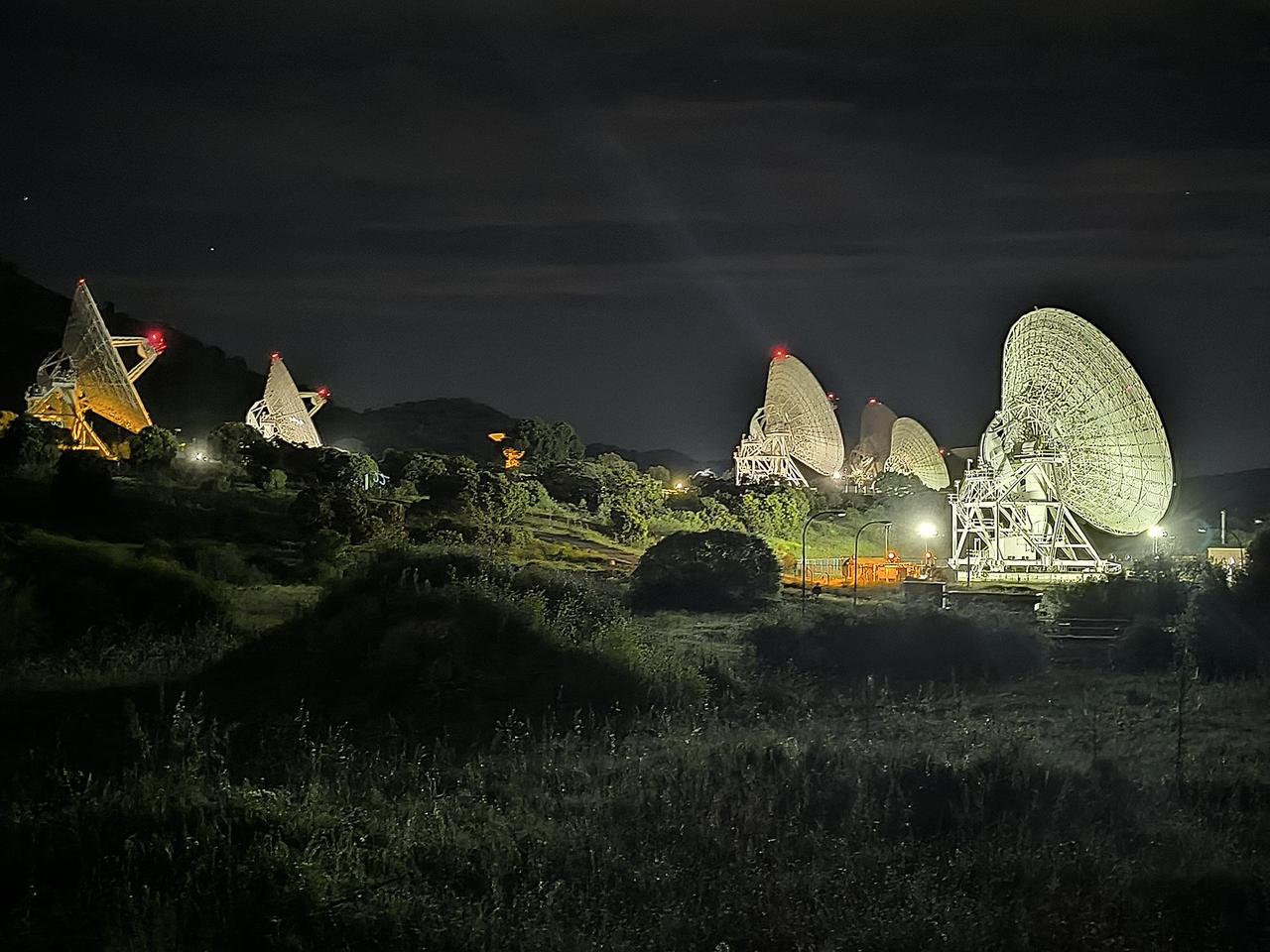  In a historic first, all six radio frequency antennas at the Madrid Deep Space Communication Complex – part of NASA's Deep Space Network (DSN) – carried out a test to receive data from the agency's Voyager 1 spacecraft at the same time on April 20, 2024. Known as "arraying," combining the receiving power of several antennas allows the DSN to collect the very faint signals from faraway spacecraft. A five-antenna array is currently needed to downlink science data from the spacecraft's Plasma Wave System (PWS) instrument. As Voyager gets further way, six antennas will be needed.  The Voyager team is currently working to fix an issue on the spacecraft that has prevented it from sending back science data since November.  Though the antennas located at the DSN's three complexes – Goldstone in California, Canberra in Australia, and Madrid – have been arrayed before, this is the first instance of six antennas being arrayed at once. Madrid is the only deep space communication complex currently with six operational antennas (the other two complexes have four apiece). Each complex consists of one 70-meter (230-foot) antenna and several 34-meter (112-foot) antennas.  Voyager 1 is over 15 billion miles (24 billion kilometers) away, so its signal on Earth is far fainter than any other spacecraft with which the DSN communicates. It currently takes Voyager 1's signal over 22 ½ hours to travel from the spacecraft to Earth. To better receive Voyager 1's radio communications, a large antenna – or an array of multiple smaller antennas – can be used.  Voyager 1 and its twin, Voyager 2, are the only spacecraft ever to fly in interstellar space (the space between stars).  https://photojournal.jpl.nasa.gov/catalog/PIA26147