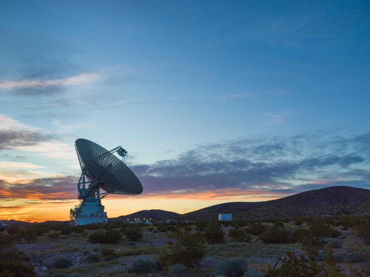 This sunset photo shows Deep Space Station 14 (DSS-14), the 230-foot-wide (70-meter) antenna at the Goldstone Deep Space Communications Complex near Barstow, California, part of NASA's Deep Space Network. The network's three complexes around the globe support communications with dozens of deep space missions. DSS-14 is also the agency's Goldstone Solar System Radar, which is used to observe asteroids that come close to Earth.  https://photojournal.jpl.nasa.gov/catalog/PIA26150