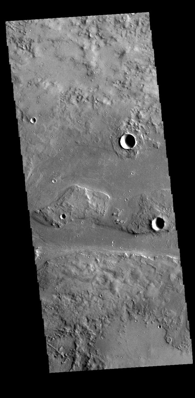 This VIS image shows part of Granicus Valles. Granicus Valles is a complex channel system located west of Elysium Mons. The system is approximately 750km (466 miles) long. It is likely that both water and lava played a part in creation of the feature. Orbit Number: 94832 Latitude: 28.5187 Longitude: 217.227 Instrument: VIS Captured: 2023-05-01 18:38 https://photojournal.jpl.nasa.gov/catalog/PIA26193