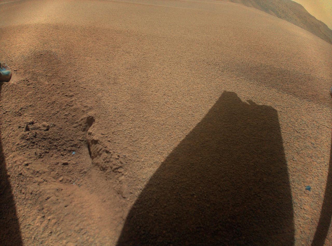 After its 72nd flight on Jan. 18, 2024, NASA's Ingenuity Mars Helicopter captured this color image showing the shadow of a rotor blade damaged during a rough landing.  https://photojournal.jpl.nasa.gov/catalog/PIA26243