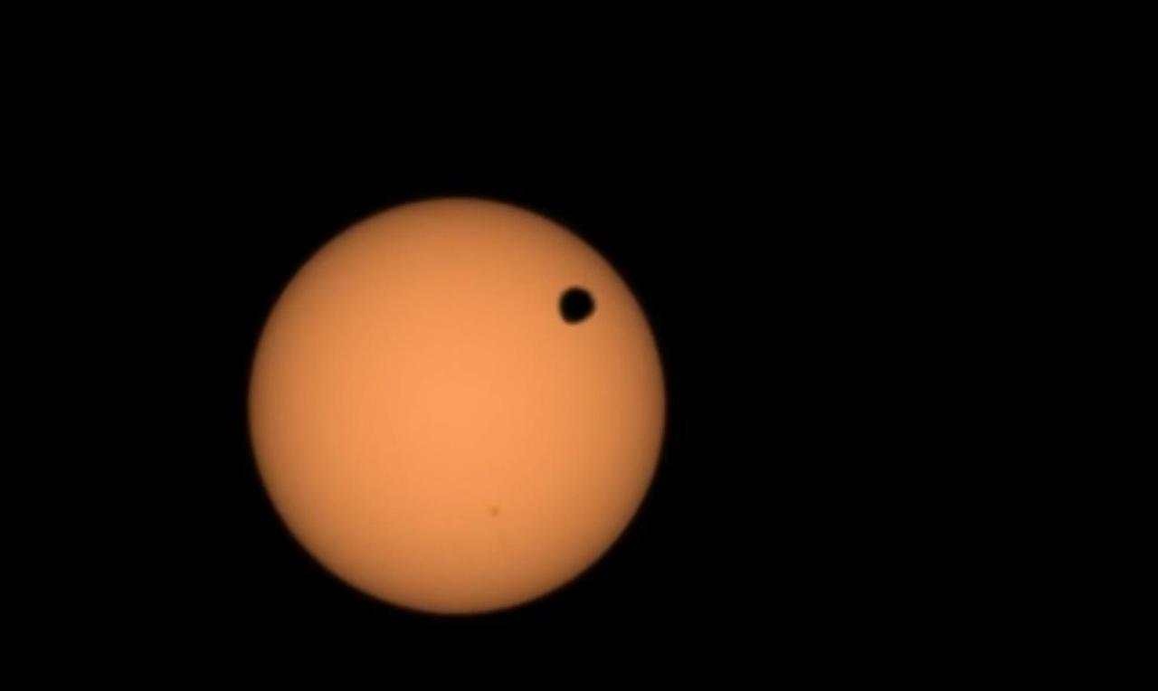 NASA's Perseverance Mars rover used its Mastcam-Z camera to capture the silhouette of Deimos, one of the two Martian moons, as it passed in front of the Sun on Jan. 19, 2024, the 1,037th Martian day, or sol, of the mission. This is one of several transits of Deimos that NASA's Mars rovers have captured. By comparing the various recordings over time, scientists can refine their understanding of the tiny moon's orbit, learning how it's changing.  The video has been sped up by four times; the full transit took over two minutes.  Arizona State University leads the operations of the Mastcam-Z instrument, working in collaboration with Malin Space Science Systems in San Diego, on the design, fabrication, testing, and operation of the cameras, and in collaboration with the Niels Bohr Institute of the University of Copenhagen on the design, fabrication, and testing of the calibration targets.  A key objective for Perseverance's mission on Mars is astrobiology, including the search for signs of ancient microbial life. The rover will characterize the planet's geology and past climate, pave the way for human exploration of the Red Planet, and be the first mission to collect and cache Martian rock and regolith (broken rock and dust).  Subsequent NASA missions, in cooperation with ESA (European Space Agency), would send spacecraft to Mars to collect these sealed samples from the surface and return them to Earth for in-depth analysis.  The Mars 2020 Perseverance mission is part of NASA's Moon to Mars exploration approach, which includes Artemis missions to the Moon that will help prepare for human exploration of the Red Planet.  Video available at https://photojournal.jpl.nasa.gov/catalog/PIA26249