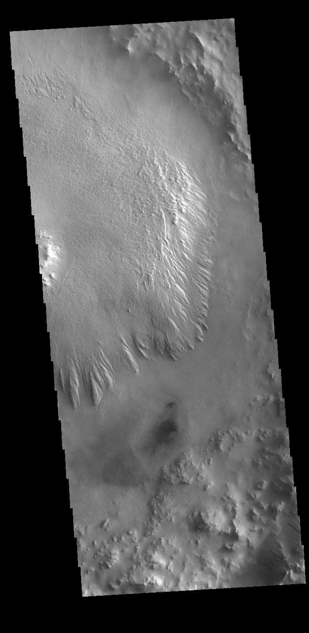 Today's VIS image shows a portion of the floor of an unnamed crater in Arabia Terra. Like several other craters on Mars, including the nearby Henry Crater, this crater contains a large mound of material that filled a large part of the crater floor. This mound has been subsequently eroded by the wind. These materials were brought into the crater sometime after the impact that formed the crater.  Orbit Number: 95048 Latitude: 8.48497 Longitude: 21.1439 Instrument: VIS Captured: 2023-05-19 13:22  https://photojournal.jpl.nasa.gov/catalog/PIA26253