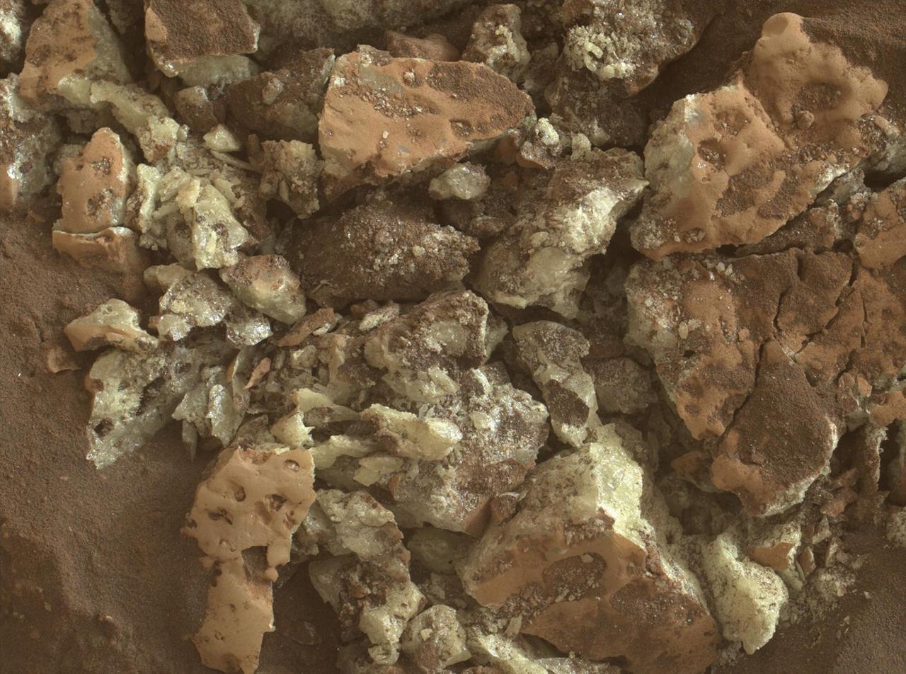 These sulfur crystals were found inside a rock after NASA's Curiosity Mars rover happened to drive over it and crush it on May 30, 2024, the 4,200th Martian day, or sol, of the mission. This image was captured by Curiosity's Mars Hand Lens Imager (MAHLI), a camera on the end of its robotic arm, on June 4, 2024, the 4,205th Martian day, or sol, of the mission.  This rock was nicknamed "Convict Lake" after a location in California's Sierra Nevada. Curiosity's Alpha Particle X-Ray Spectrometer (APXS) found that the crystalline material is elemental sulfur.  https://photojournal.jpl.nasa.gov/catalog/PIA26307
