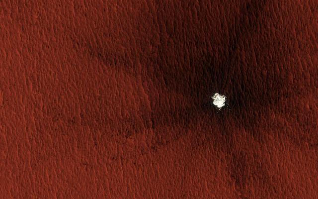 NASA image:  Mars Mysteries: Unveiling the Icy Craters