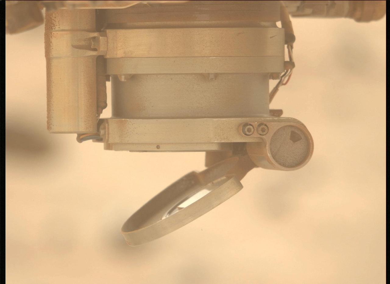 On May 11, 2024, the 1,147th Martian day, or sol, of Perseverance's mission, the Mastcam-Z instrument aboard the NASA Mars rover took these three images showing movement of the cover for the Autofocus and Context Imager (ACI) camera during a test to characterize the behavior of the cover mechanism.  Part of the SHERLOC (Scanning Habitable Environments with Raman & Luminescence) instrument, the cover is designed to protect the instrument's spectrometer and one of its cameras from dust. On Jan. 6, 2024, the cover froze in a position that prevented SHERLOC from collecting data. The rover team found a way to address the issue so the instrument can continue to operate.  A key objective for Perseverance's mission on Mars is astrobiology, including the search for signs of ancient microbial life. The rover is also characterizing the planet's geology and past climate, which paves the way for human exploration of the Red Planet. JPL, which is managed for NASA by Caltech in Pasadena, California, built and manages operations of the Perseverance rover.  Animation available at https://photojournal.jpl.nasa.gov/catalog/PIA26338