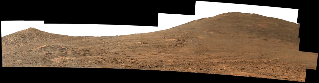 NASA's Perseverance Mars rover used its Mastcam-Z instrument to capture this view looking south toward the rim of Jezero Crater. The panorama, which encompasses 80 degrees, is made up of 59 individual images. They were captured on Aug. 4, 2024, the 1,229th Martian day, or sol, of the mission, and stitched together after being sent back to Earth. The color has been enhanced to bring out subtle details.  "Dox Castle," a region the Perseverance science team wants to visit during the rover's climb up the crater rim, is about a half-mile (740 meters) away, on the left side of the hill at right. After the exploration of Dox Castle is complete, the rover will continue its climb up the crater rim, taking a route somewhere in between the two hills.  Arizona State University leads the operations of the Mastcam-Z instrument, working in collaboration with Malin Space Science Systems in San Diego, on the design, fabrication, testing, and operation of the cameras, and in collaboration with the Niels Bohr Institute of the University of Copenhagen on the design, fabrication, and testing of the calibration targets.  A key objective for Perseverance's mission on Mars is astrobiology, including the search for signs of ancient microbial life. The rover will characterize the planet's geology and past climate, pave the way for human exploration of the Red Planet, and be the first mission to collect and cache Martian rock and regolith (broken rock and dust).  https://photojournal.jpl.nasa.gov/catalog/PIA26373