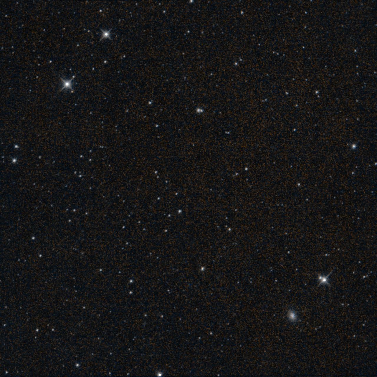 This starfield was imaged by NASA's Near-Earth Object Wide-field Infrared Survey Explorer (NEOWISE) moments before the mission's science survey ended at midnight on July 31, 2024. The observation shows part of Fornax, a constellation that is visible in Southern Hemisphere skies.  The spacecraft's final image, which was processed by IPAC at Caltech, takes in a view about three times the width of Earth's full Moon. This infrared exposure is the space telescope's 26,886,704th, a number that includes observations captured during its WISE (Wide-field Infrared Survey Explorer) mission. In addition to the stars and galaxies that appear as points of light, the spiral galaxy NGC 1339 can be seen as a fuzzy oval in the bottom right of the observation. NGC 1339 is about 64 million light-years from Earth.  On Aug. 8, a week after the image was captured, project engineers commanded the spacecraft to turn its transmitter off for the last time. This concluded more than 10 years of the planetary defense mission's search for asteroids and comets, including those that could pose a threat to Earth. By repeatedly observing the sky from low Earth orbit, NEOWISE created all-sky maps featuring 1.45 million infrared measurements of more than 44,000 solar system objects. Of the 3,000-plus near-Earth objects it detected, 215 were first spotted by NEOWISE. The mission also discovered 25 new comets, including the famed comet C/2020 F3 NEOWISE.  https://photojournal.jpl.nasa.gov/catalog/PIA26385